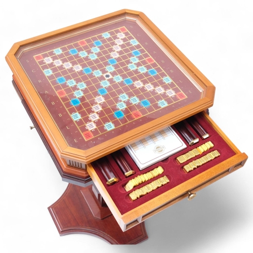 117 - A Franklin Mint Collector's Edition Scrabble board and accessories, with 22ct gold plated tiles, rem... 