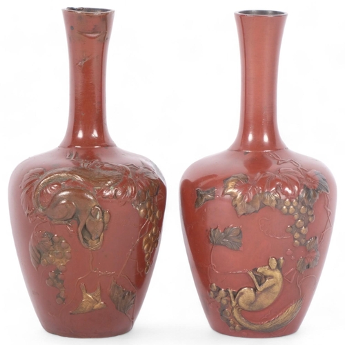 120 - A pair of small Japanese Meiji Period vases, with gilded animals and grapevine decoration, 10cm