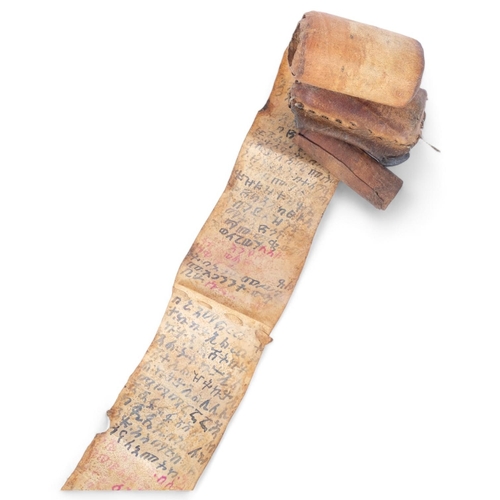 125 - An Ethiopian Tribal Talismanic velum (calf skin) scroll, handwritten in late 20th century with Ethio... 