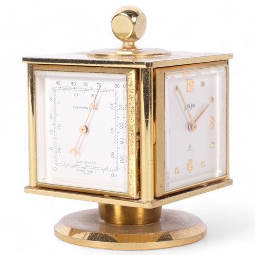 138 - NEIMAN-MARCUS - a mid-century gilt-brass desk clock and weather compendium, on revolving stand, Swis... 