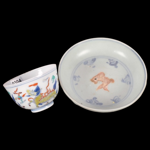 180 - A Chinese Doucai porcelain 'Qilin' tea bowl, with 6 character mark on base, and a Chinese blue and w... 