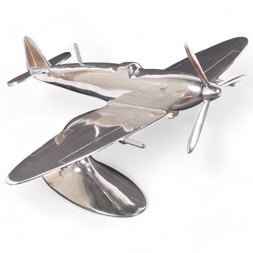 24 - A large aluminium desk-top model Spitfire, unsigned, 50cm