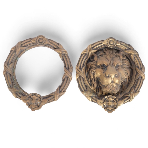 38 - A large cast-brass lion mask door knocker, and another plain door knocker, diameter 23cm (2)