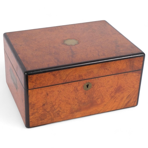 39 - An early 20th century walnut vanity box, with ebony moulding, brass hidden handles, green leather in... 