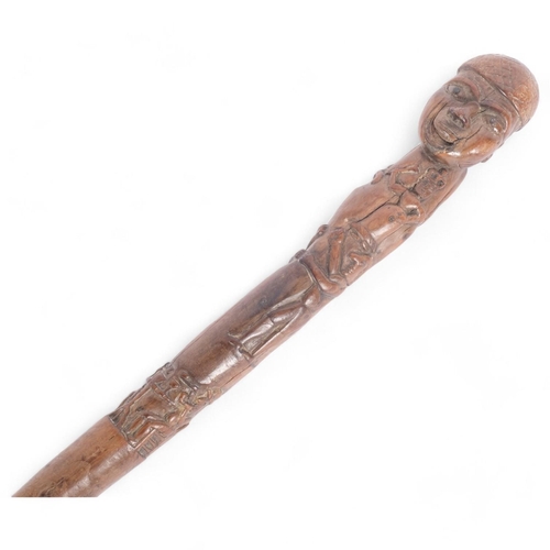 4 - WITHDRAWN - An Antique Folk Art stick/staff, heavily carved depicting figures boxing, smoking pipes ... 