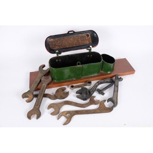 58 - A Bamfords stationary engine painted cast-iron toolbox, containing various spanners, mounted on wood... 