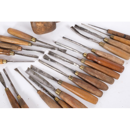 62 - 21 Vintage wood carving tools, to include chisels, and a carver's mallet