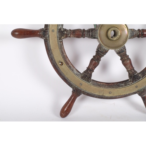 74 - An Antique teak and brass-bound ship's wheel, diameter 64cm