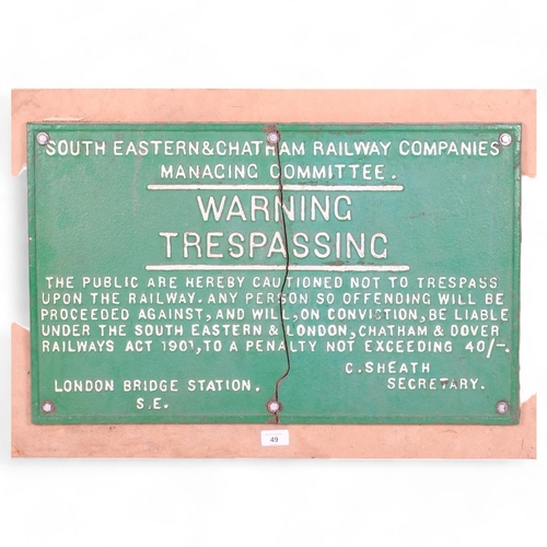 79 - South Eastern and Chatham Railway Companies Manacing Committee, a cast-iron sign (Warning Trespassin... 