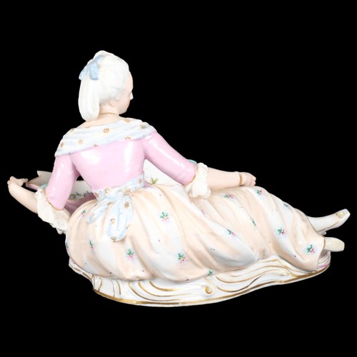 21 - MEISSEN - a large 19th century porcelain sweetmeat basket, modelled as a lady lying beside a basket ... 