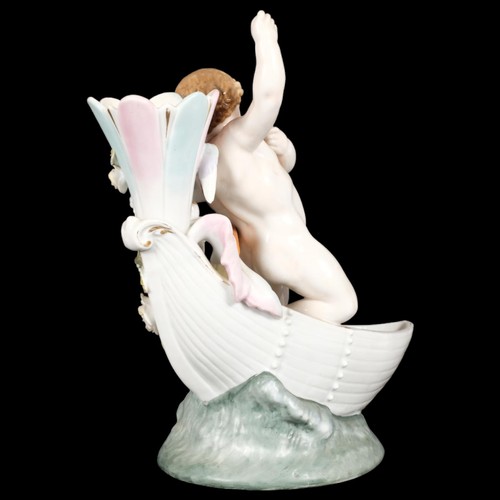 22 - MEISSEN - a 19th century porcelain bud vase, modelled as Cupid in a boat, overpainted underglaze blu... 