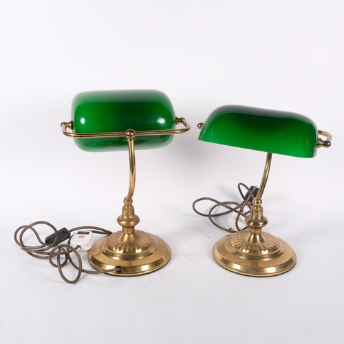 423 - A pair of embossed brass adjustable banker's table-top lamps with green shades, H34cm