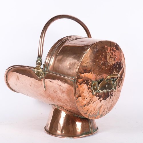 425 - A Victorian copper coal scuttle with swing handle, L44cm