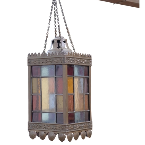 430 - A square embossed pressed metal ceiling light, with multi-coloured leadlight panels, H28cm