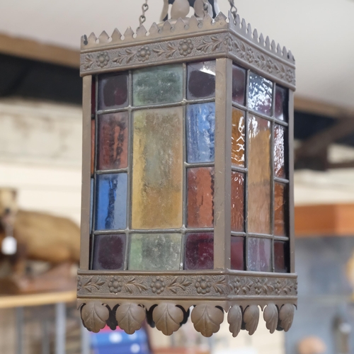 430 - A square embossed pressed metal ceiling light, with multi-coloured leadlight panels, H28cm