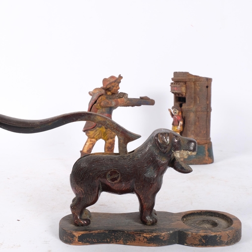 458 - A cast-iron dog figure nutcracker, and a mechanical cast-iron William Tell money box, L26cm