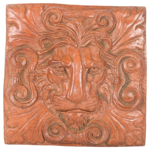 466 - A moulded terracotta finished lion mask wall plaque with hanger, H30cm