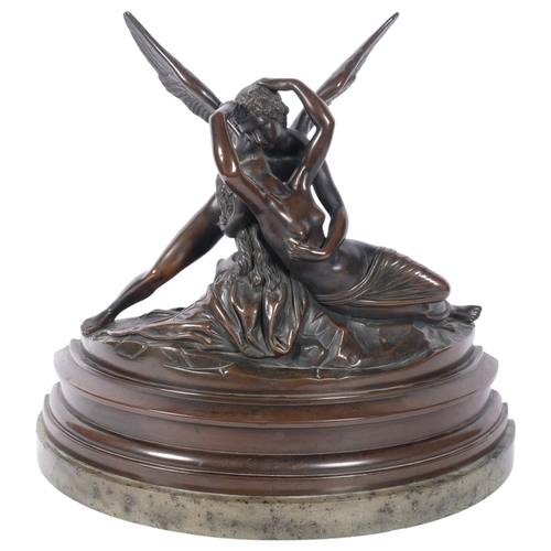 467 - A large patinated resin sculpture depicting Cupid and Psyche, on marble plinth, H37cm