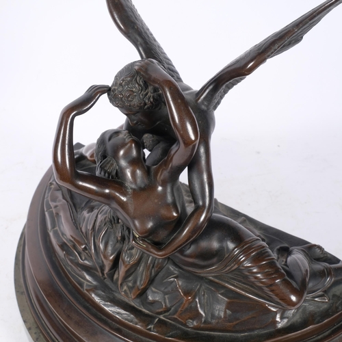 467 - A large patinated resin sculpture depicting Cupid and Psyche, on marble plinth, H37cm