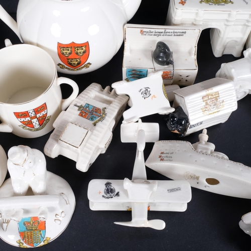 624 - A collection of miniature Crested ware ornaments, including First World War tanks, and vehicles, a C... 