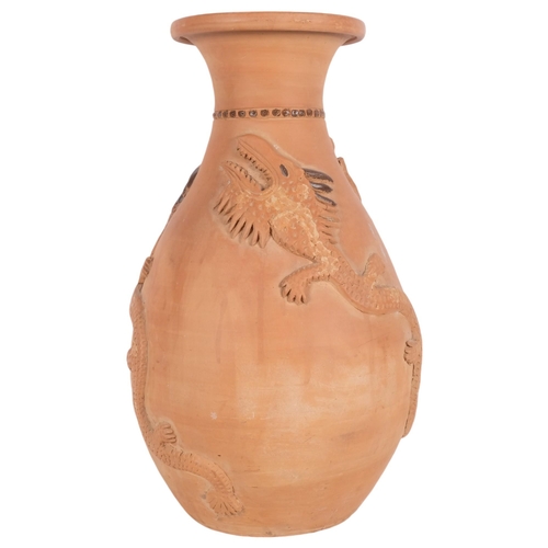 630 - A large terracotta pot with applied lizards, 51cm