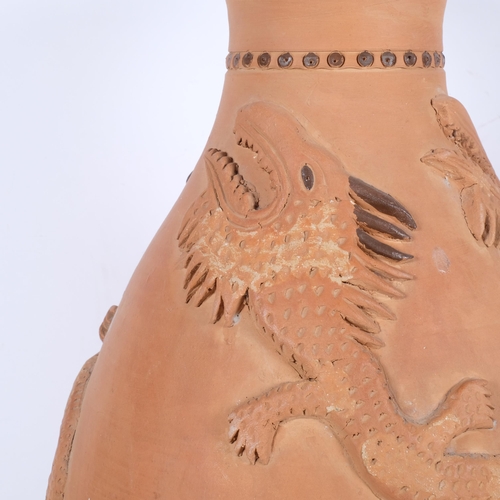 630 - A large terracotta pot with applied lizards, 51cm