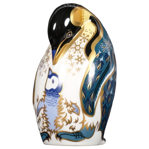 643 - A Royal Crown Derby porcelain penguin and chick paperweight, with silver button, 12cm