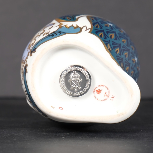 643 - A Royal Crown Derby porcelain penguin and chick paperweight, with silver button, 12cm