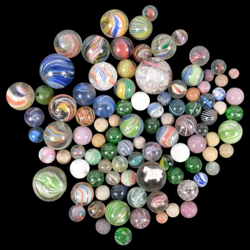 668 - A collection of 19th and 20th century glass marbles, including latticino and Victorian sulphide exam... 