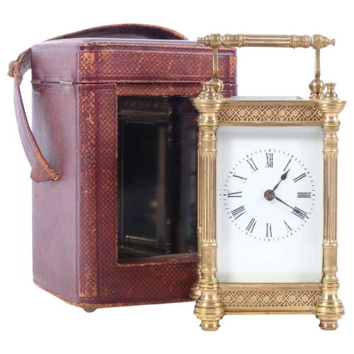 670 - A brass-cased carriage clock, with column pillar supports and swing handle, back plate no. 27, in le... 