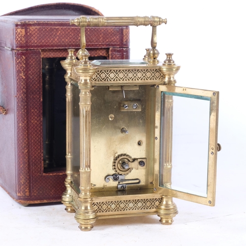 670 - A brass-cased carriage clock, with column pillar supports and swing handle, back plate no. 27, in le... 