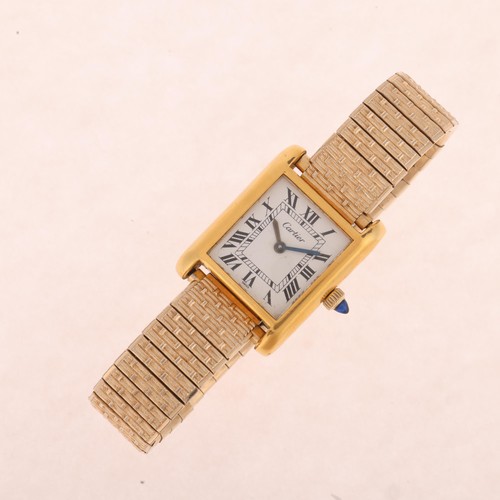 1002 - CARTIER - an 18k gold electroplated Tank mechanical wristwatch, ref. 5512106, white dial with black ... 