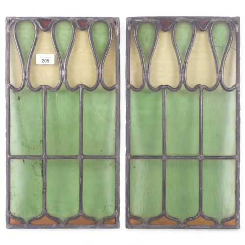 209 - A pair of Art Nouveau leadlight stained glass window panels, each 44cm x 24cm