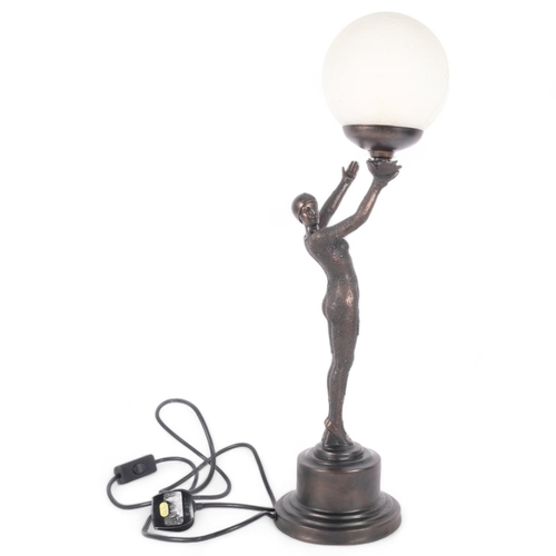 219 - An Art Deco style patinated resin figural dancer table lamp, with crackle glass globe shade, H62cm