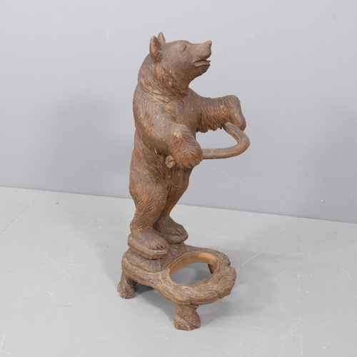 44 - A late 19th century German Black Forest bear stick stand, modelled standing upright with original gl... 