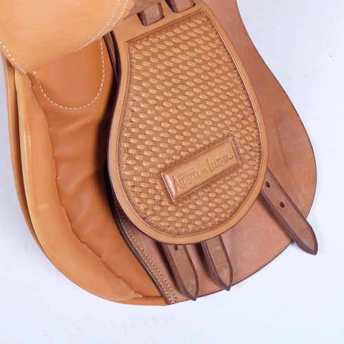 234 - A handmade and hand stamped tan leather horse riding saddle, by Borrer Artistry In Leather, RRP £1,9... 