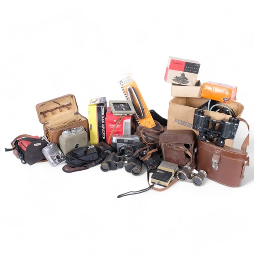 304 - A quantity of Vintage cameras and associated equipment, including various binoculars, handheld cine-... 