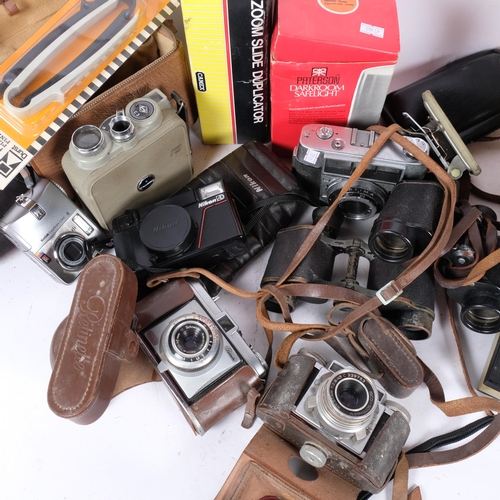 304 - A quantity of Vintage cameras and associated equipment, including various binoculars, handheld cine-... 