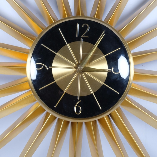 332 - A retro style sunburst clock, no maker's label, diameter 60cm