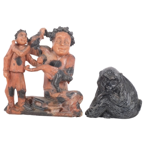 889 - A soapstone carving of 3 figures, H14cm, and carved stone baboon