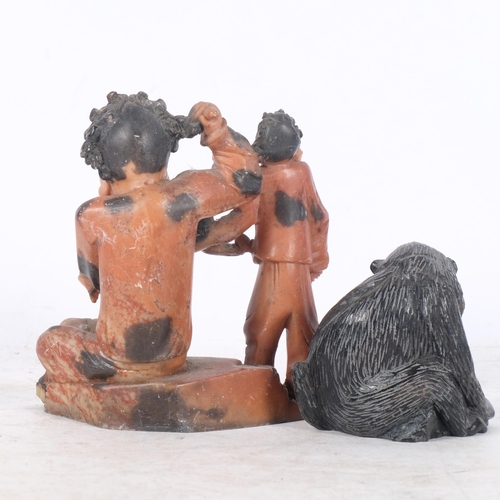 889 - A soapstone carving of 3 figures, H14cm, and carved stone baboon