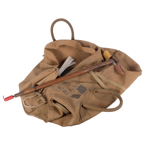 898 - A Vintage mountaineer's climbing pickaxe, and a canvas travel bag (2)