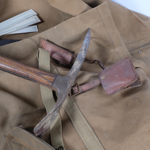 898 - A Vintage mountaineer's climbing pickaxe, and a canvas travel bag (2)