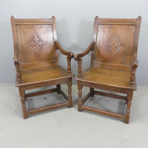 2732 - A pair of late 19th / early 20th century joined oak Wainscot chairs, with panelled backs and carved ... 