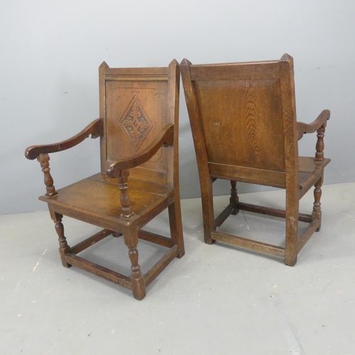 2732 - A pair of late 19th / early 20th century joined oak Wainscot chairs, with panelled backs and carved ... 