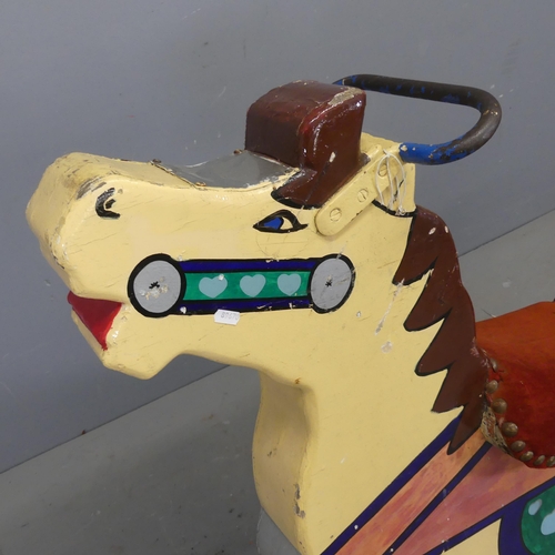 2739 - A vintage painted fairground carousel horse. W110cm, H100cm, D30cm.