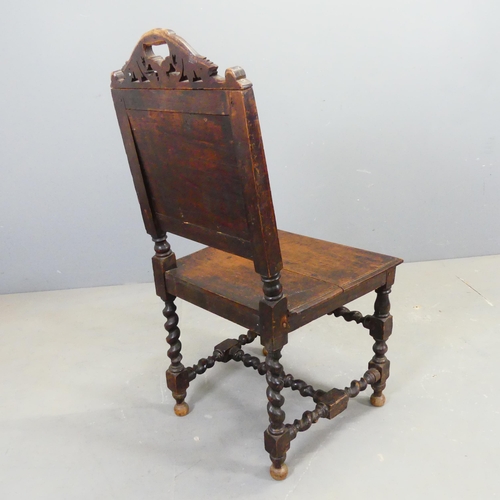 2752 - A 17th century style oak chair, with carved decoration and barley twist supports.