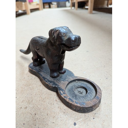 458 - A cast-iron dog figure nutcracker, and a mechanical cast-iron William Tell money box, L26cm