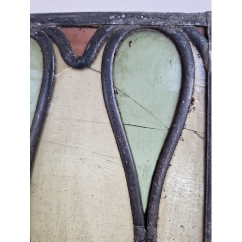 209 - A pair of Art Nouveau leadlight stained glass window panels, each 44cm x 24cm