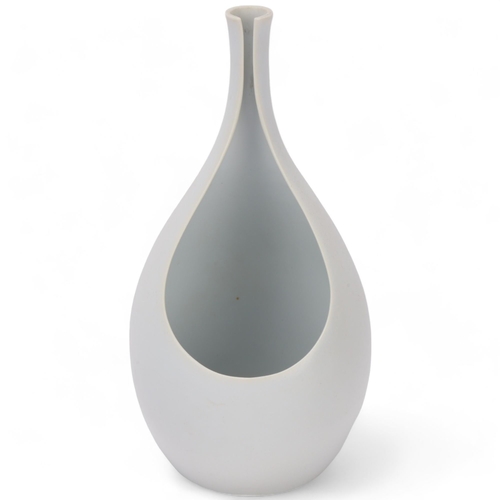 424 - STIG LINDBERG (1916-1981) for Gustavsberg, Sweden, a 1950s' designed white glaze Pungo vase, makers ... 